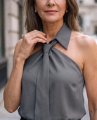 Lumina Wear Luna sleeveless halter blouse with neck tie, featuring lightweight fabric and stylish design, shown on a model.
