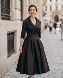 Vintage Aurora Lumina Wear midi dress featuring a flowing fabric, floral pattern, and elegant neckline in a stylish, classic design.