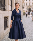 Vintage Aurora Midi Dress by Lumina Wear featuring a flowy fabric, elegant design, and a classic midi length.