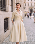 Vintage Aurora Midi Dress by Lumina Wear displayed on a hanger, featuring a flowing fabric and elegant design.