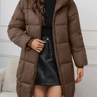 Redish-brown Lumina Wear Holly longline hooded puffer coat with minimalist design, cozy and warm for cold weather.