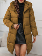 Redish-brown Holly longline hooded puffer coat by Lumina Wear featuring a minimalist design and cozy, insulated puffer style.