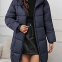 Redish-brown Holly Lumina Wear cozy longline hooded puffer coat with minimalist design, lightweight and warm for winter.