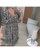 Red boho printed dress by Lumina Vancouver featuring a flowy silhouette and intricate patterns, perfect for casual or summer wear.