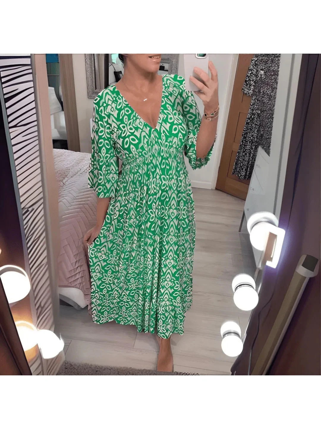 Red Elviira boho printed dress by Lumina Vancouver featuring floral patterns and flowing fabric, perfect for casual or summer wear.
