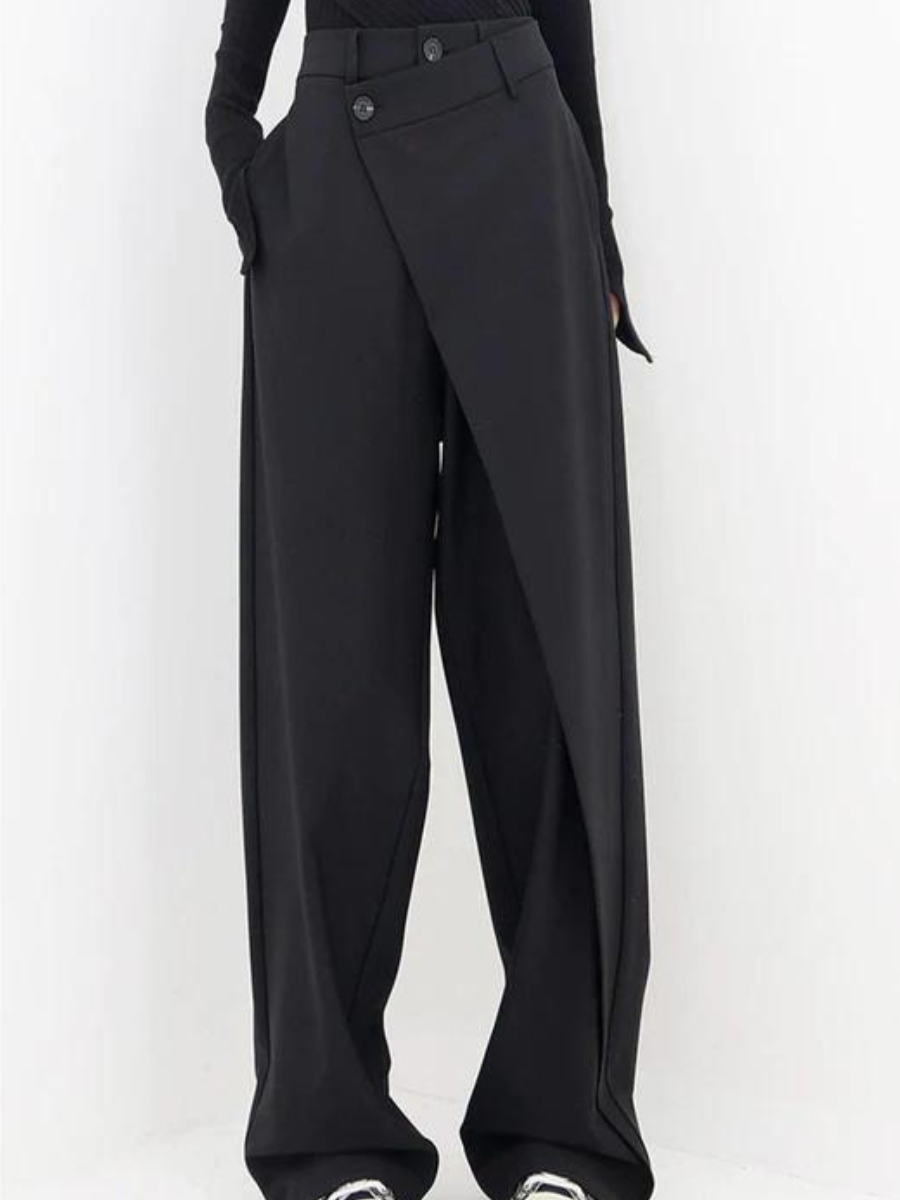 Black Isabella Lumina Wear chic asymmetric wide-leg trousers, shown on a model with a sleek, modern fit and stylish design.