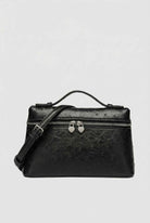 Lumina Wear Isabella black crossbody bag with adjustable strap, stylish and compact handbag for everyday use.