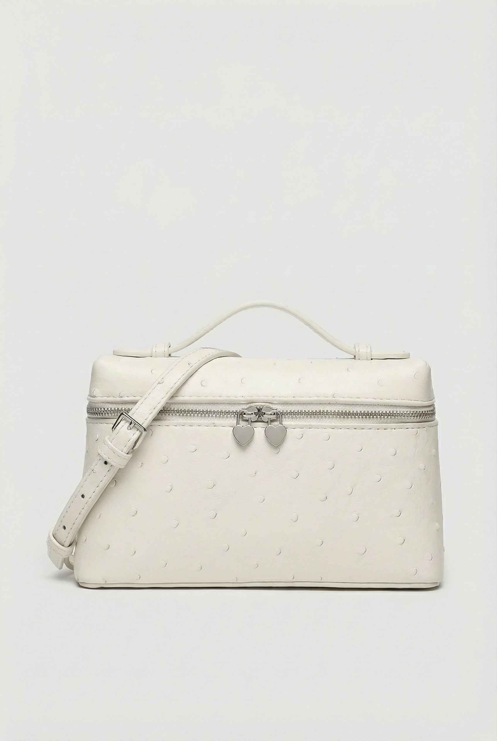 Lumina Wear Isabella black crossbody bag with adjustable strap, featuring a chic design and compact silhouette for everyday use.