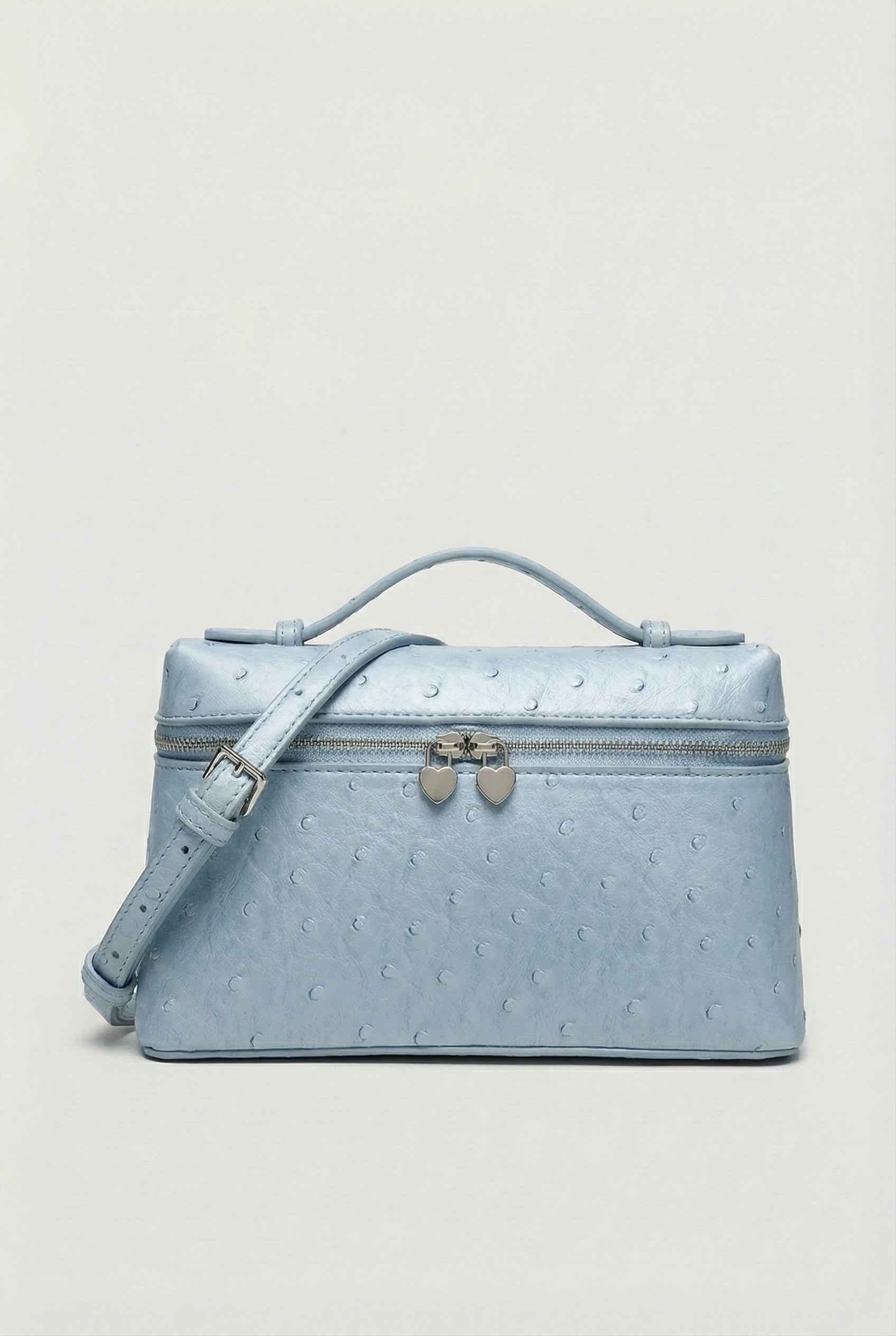 Lumina Wear Isabella black crossbody bag with adjustable strap, featuring chic design and compact size for everyday use.