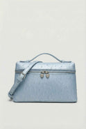 Lumina Wear Isabella black crossbody handbag with adjustable strap, stylish and compact for everyday use.
