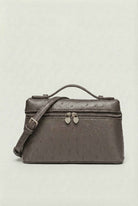 Isabella black leather crossbody handbag with adjustable strap by Lumina Wear, featuring sleek design and compact style.