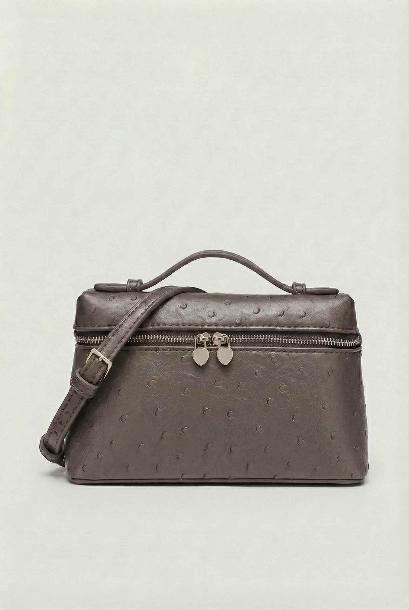 Isabella black leather crossbody handbag with adjustable strap by Lumina Wear, featuring sleek design and compact style.