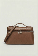 Lumina Wear Isabella black crossbody handbag with adjustable strap, stylish and compact for everyday use.