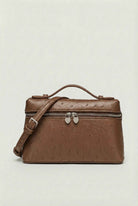 Lumina Wear Isabella black crossbody handbag with adjustable strap, stylish and compact for everyday use.