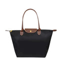 Lumina Wear Isabella black faux leather handbag with spacious interior and chic design, perfect for stylish everyday use.