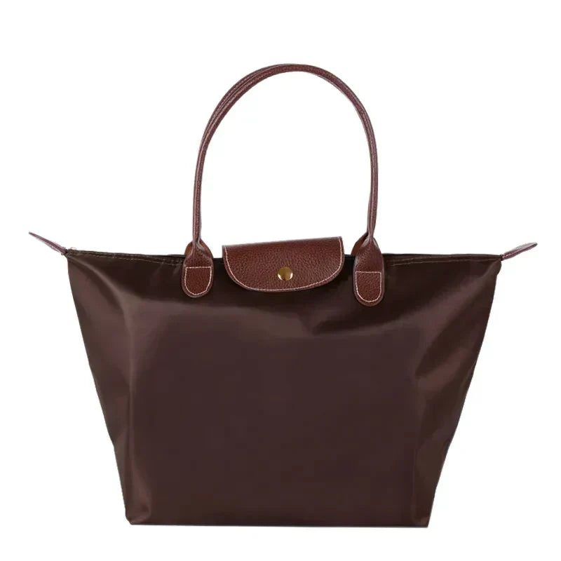 Lumina Wear Isabella chic black faux leather handbag with spacious interior and stylish design, perfect for everyday use.