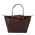 Lumina Wear Isabella chic black faux leather handbag with spacious interior and stylish design, perfect for everyday use.