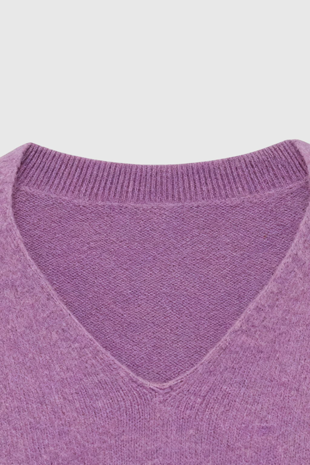 Dark purple Lumina Wear Isabella cozy sweater with a flattering fit, displayed on a plain background.