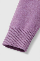 Dark purple Lumina Wear Isabella sweater with a cozy, flattering fit, featuring long sleeves and soft knit fabric.