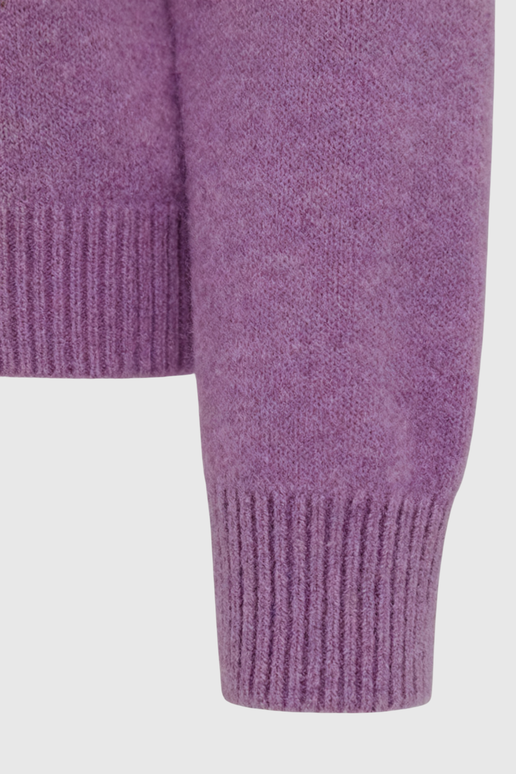 Dark purple Lumina Wear Isabella cozy sweater with flattering fit, shown on a model in a casual indoor setting.