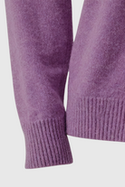 Dark purple Lumina Wear Isabella sweater with a cozy fit, featuring a flattering silhouette and soft knit fabric.