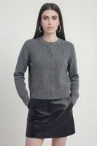 Gray long cardigan sweater by Lumina Wear, relaxed fit, cozy knit, styled casually with front pockets and open front design.