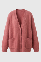 Pink knit cardigan sweater by Lumina Wear featuring a cozy, relaxed fit and soft, textured fabric.