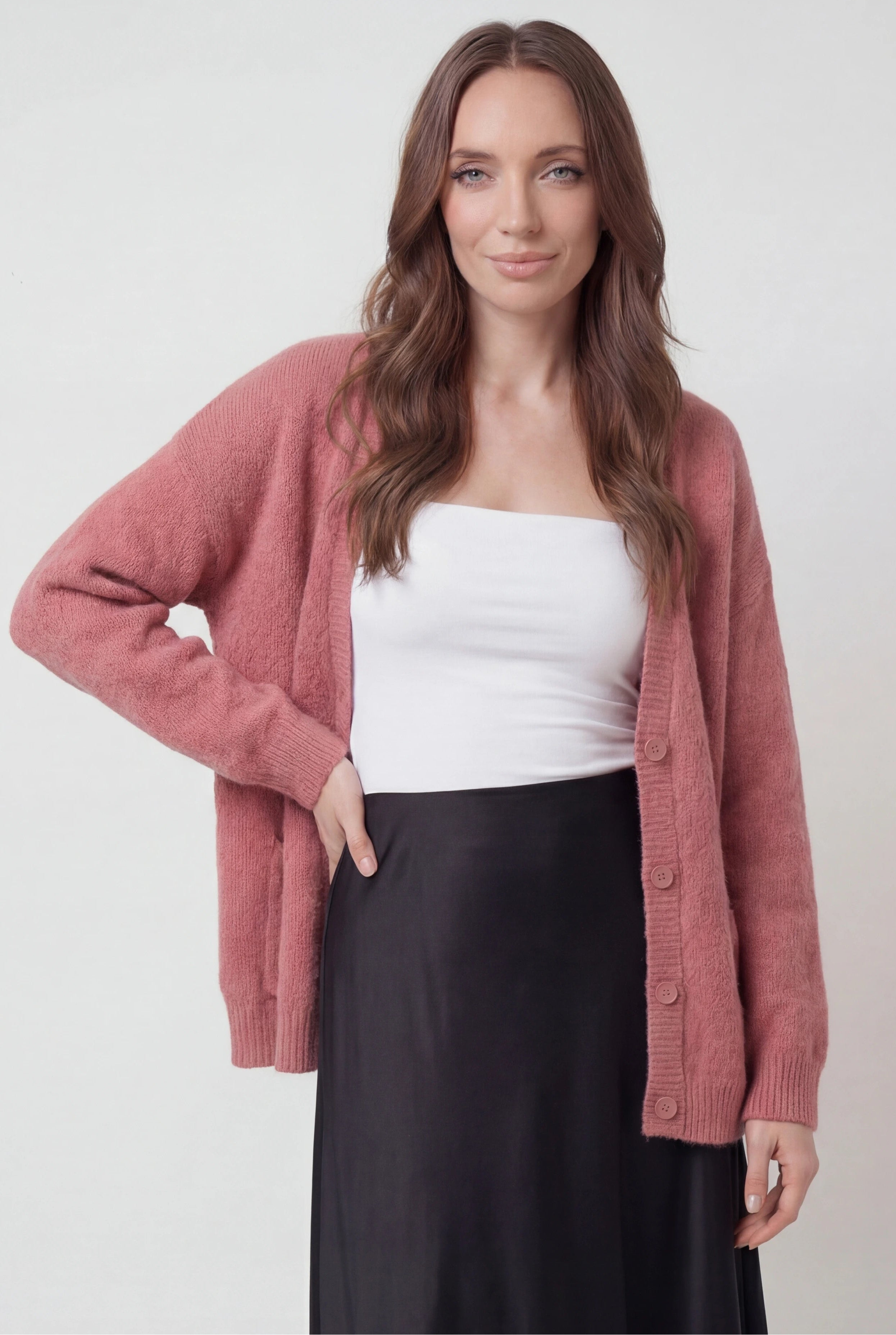 Pink knit cardigan sweater from Lumina Wear featuring a cozy, relaxed fit and soft texture, ideal for casual, comfortable style.