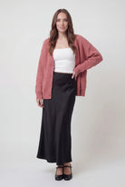 Pink knit cardigan sweater by Lumina Wear featuring a cozy, relaxed fit and soft texture, perfect for casual layered looks.