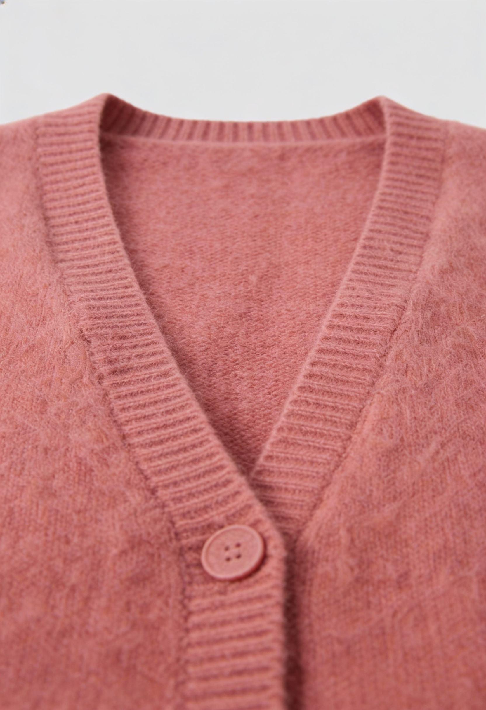 Pink knit cardigan sweater by Lumina Wear featuring a cozy, relaxed fit and soft texture, perfect for casual layered looks.