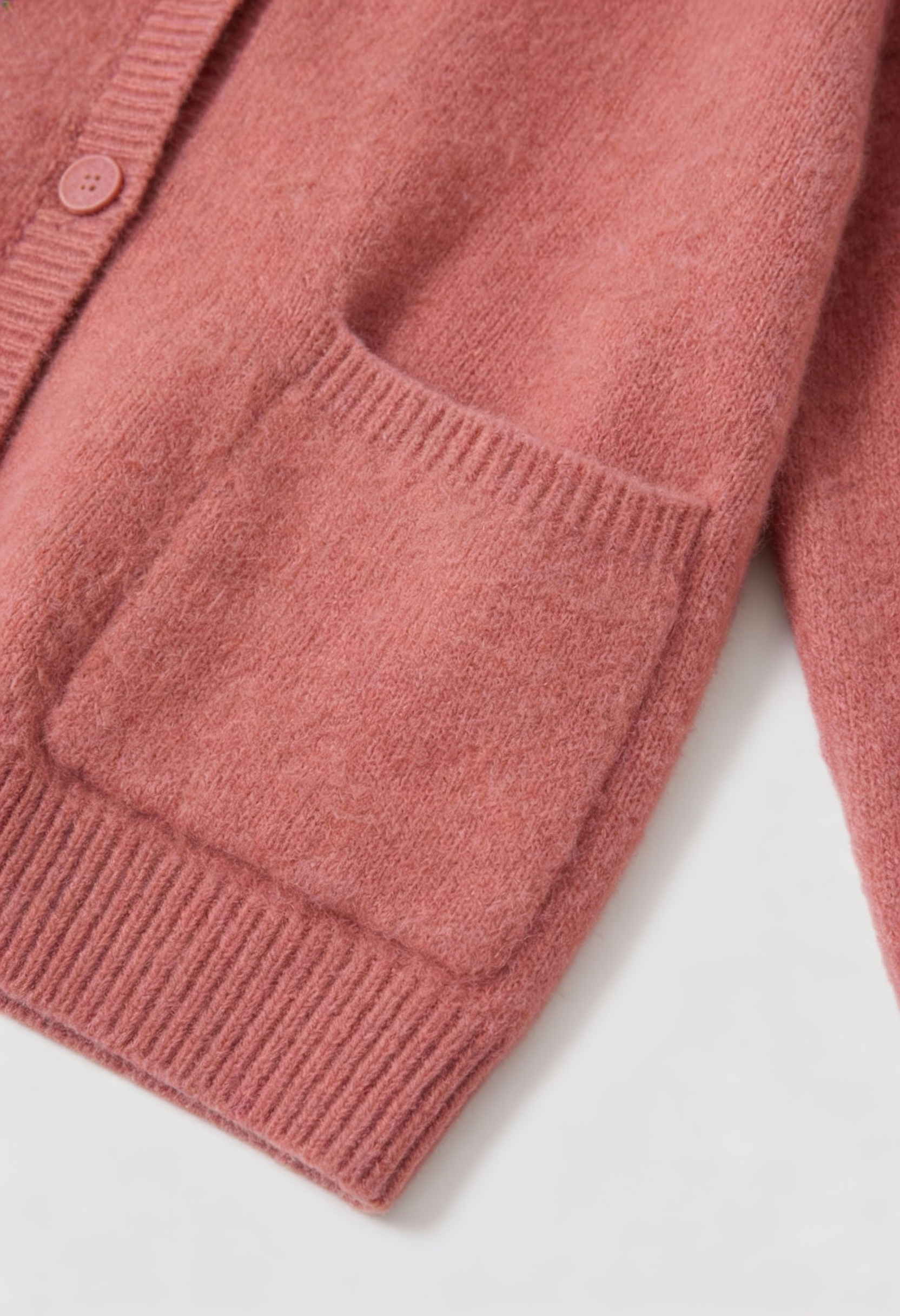 Pink knit cardigan sweater by Lumina Wear featuring a cozy, relaxed fit and soft fabric, perfect for layering.
