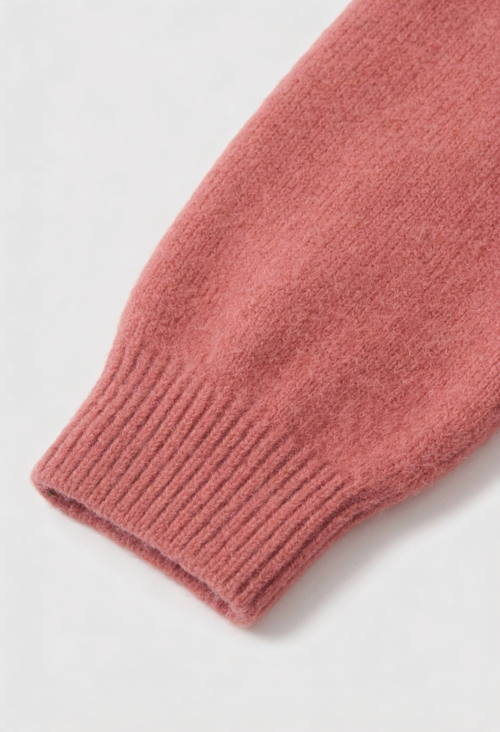 Pink knit cardigan sweater from Lumina Wear with a relaxed fit, featuring cozy texture and stylish design.