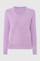 Lumina Wear Isabella cozy purple knit sweater with V-neckline, featuring soft, textured fabric and a relaxed fit.
