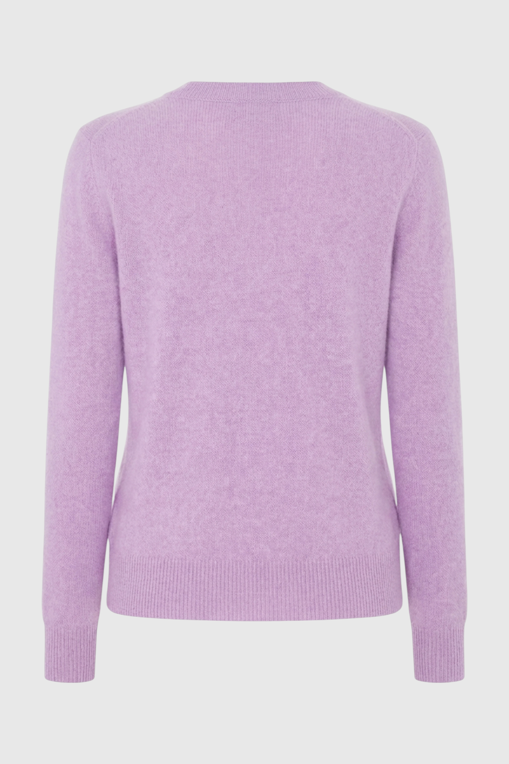 Isabella Lumina Wear cozy purple knit sweater with V-neckline, long sleeves, and ribbed cuffs, casual winter fashion for women.