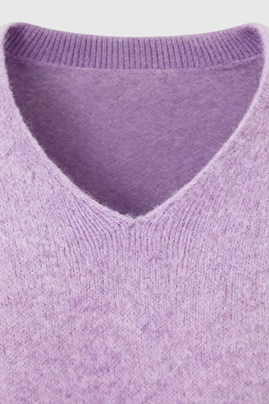 Lumina Wear Isabella purple knit sweater with V-neckline, featuring cozy, soft fabric and a stylish fit.