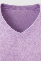 Lumina Wear Isabella purple knit sweater with V-neckline, featuring cozy, soft fabric and a stylish fit.