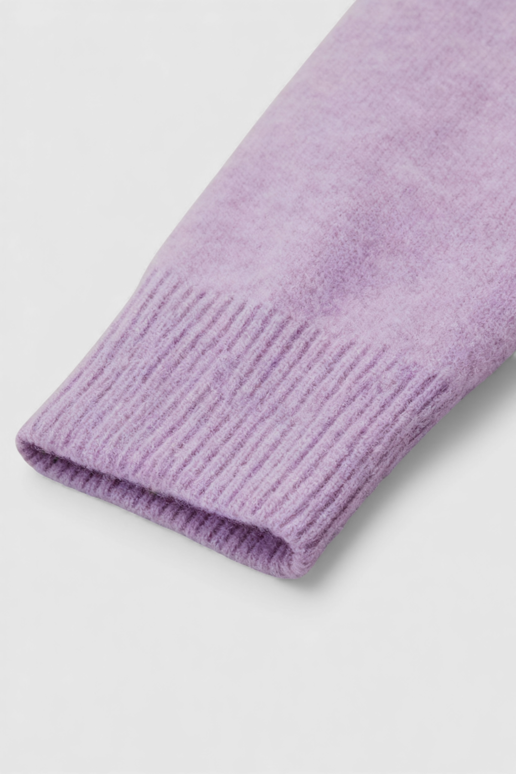 Lumina Wear Isabella cozy purple knit sweater with V-neckline, featuring a soft, textured fabric and comfortable fit.