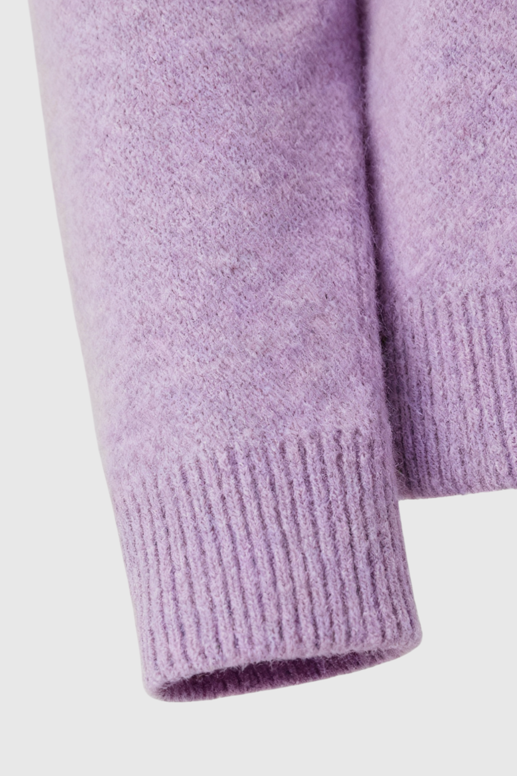 Lumina Wear Isabella purple knit sweater with V-neckline, cozy and stylish, featuring a soft textured fabric and fitted design.