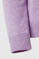 Lumina Wear Isabella purple knit sweater with V-neckline, cozy and stylish, featuring a soft textured fabric and fitted design.