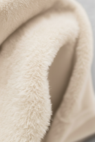 Elegant apricot turtleneck sweater by Lumina Wear featuring a slim fit, shown on a model highlighting cozy knit texture.