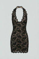 Black backless mini dress by Lumina Wear featuring a versatile cut, elegant design, and fitted silhouette for women.