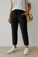 Elegant beige trousers by Lumina Wear, breathable fabric, tailored fit, styled with a sleek waistband and classic design.