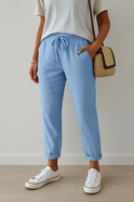 Elegant beige Lumina Wear Isabella trousers made of breathable fabric, stylish and comfortable for everyday wear.