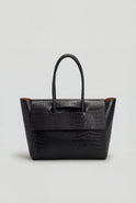 Elegant black crocodile leather handbag by Lumina Wear with adjustable strap, featuring a sophisticated design and spacious interior.