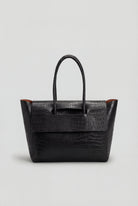 Elegant black crocodile leather handbag by Lumina Wear featuring an adjustable strap and sophisticated design.