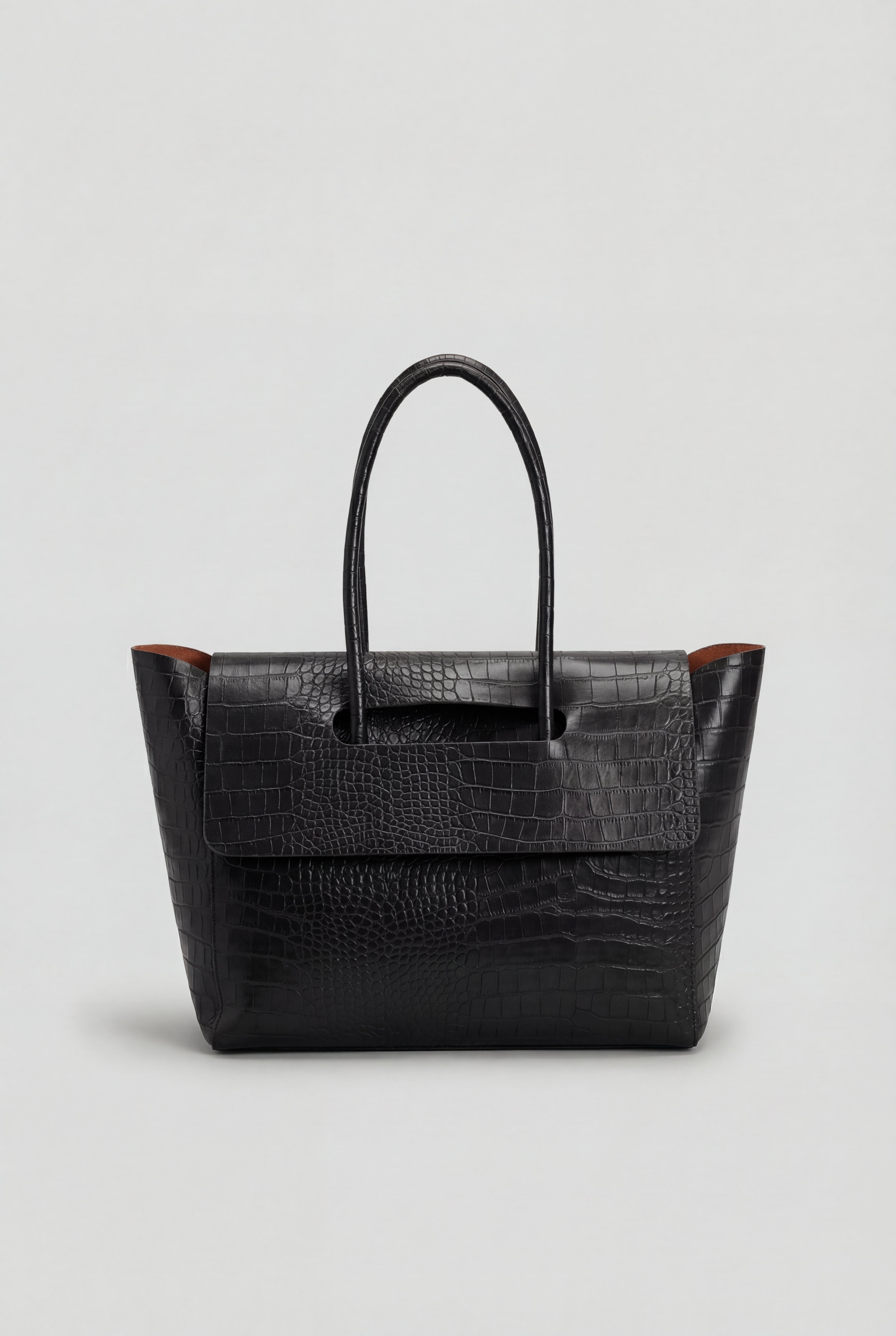 Elegant black crocodile leather handbag by Lumina Wear featuring an adjustable strap and sophisticated design.