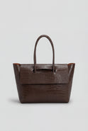 Elegant black crocodile leather handbag by Lumina Wear featuring an adjustable strap and structured design.