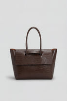Elegant black crocodile leather handbag with adjustable strap from Lumina Wear, featuring a sleek, sophisticated design.