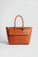 Elegant black crocodile-embossed Lumina Isabella handbag with adjustable strap and sleek design.