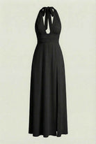 Elegant black halter neck dress by Lumina Wear, featuring a versatile fit and stylish design for various occasions.